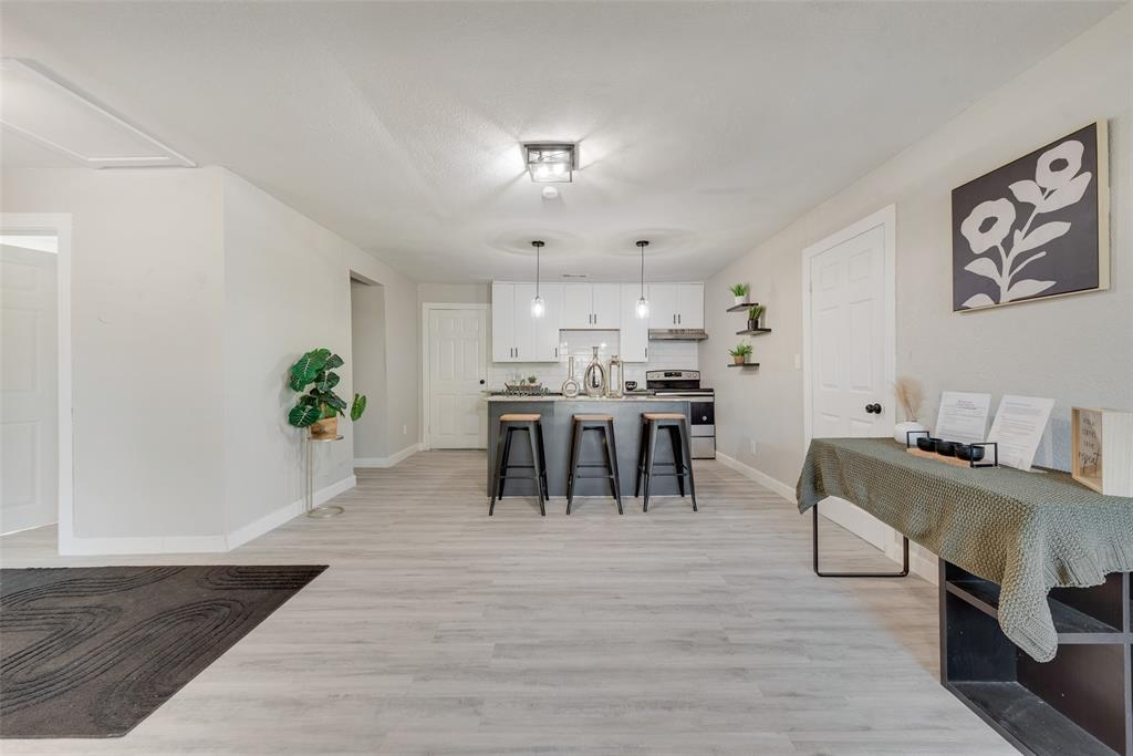 109 Lydia Street Terrell, TX 75160 - Photo 15 of 24 a view of a dining room with furniture and wooden floor