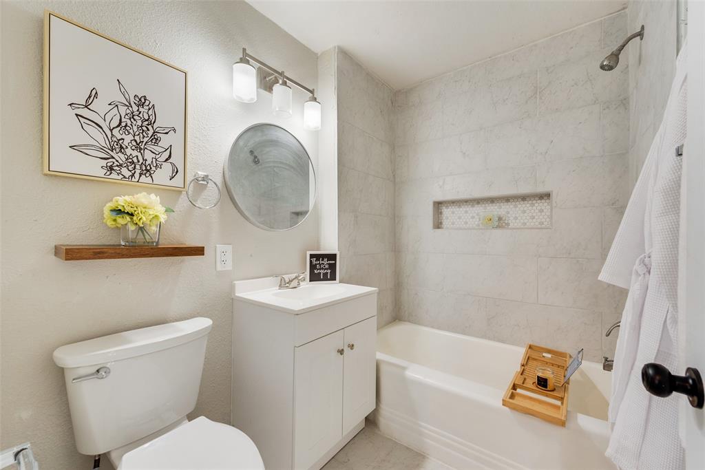 109 Lydia Street Terrell, TX 75160 - Photo 18 of 24 a bathroom with a toilet a sink and a shower