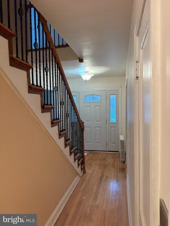 a view of entryway with wooden floor