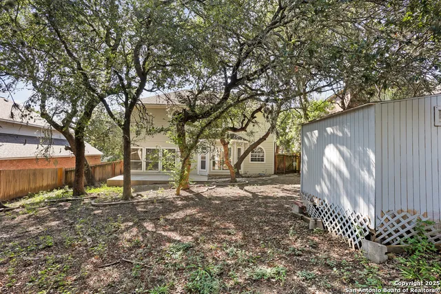 a backyard of a house with lots of green space