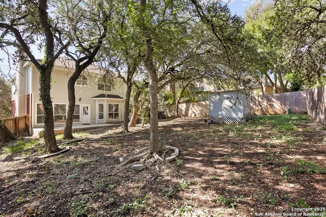 a backyard of a house with lots of green space