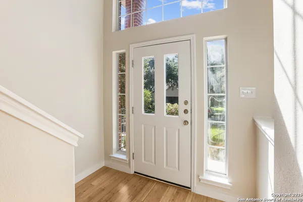 a view of front door with wooden floor