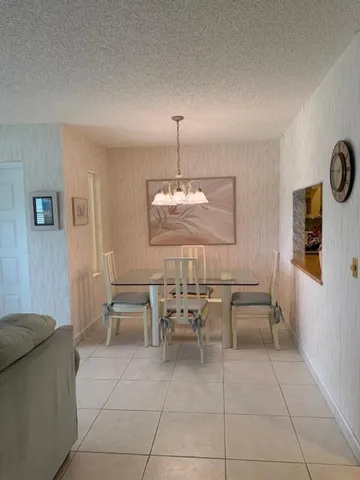 a kitchen with cabinets and white stainless steel appliances