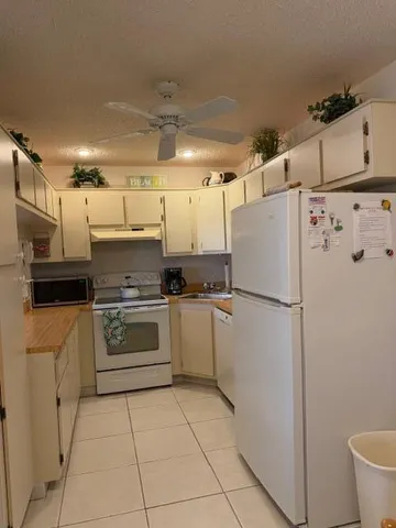 a view of a room with furniture and wooden floor