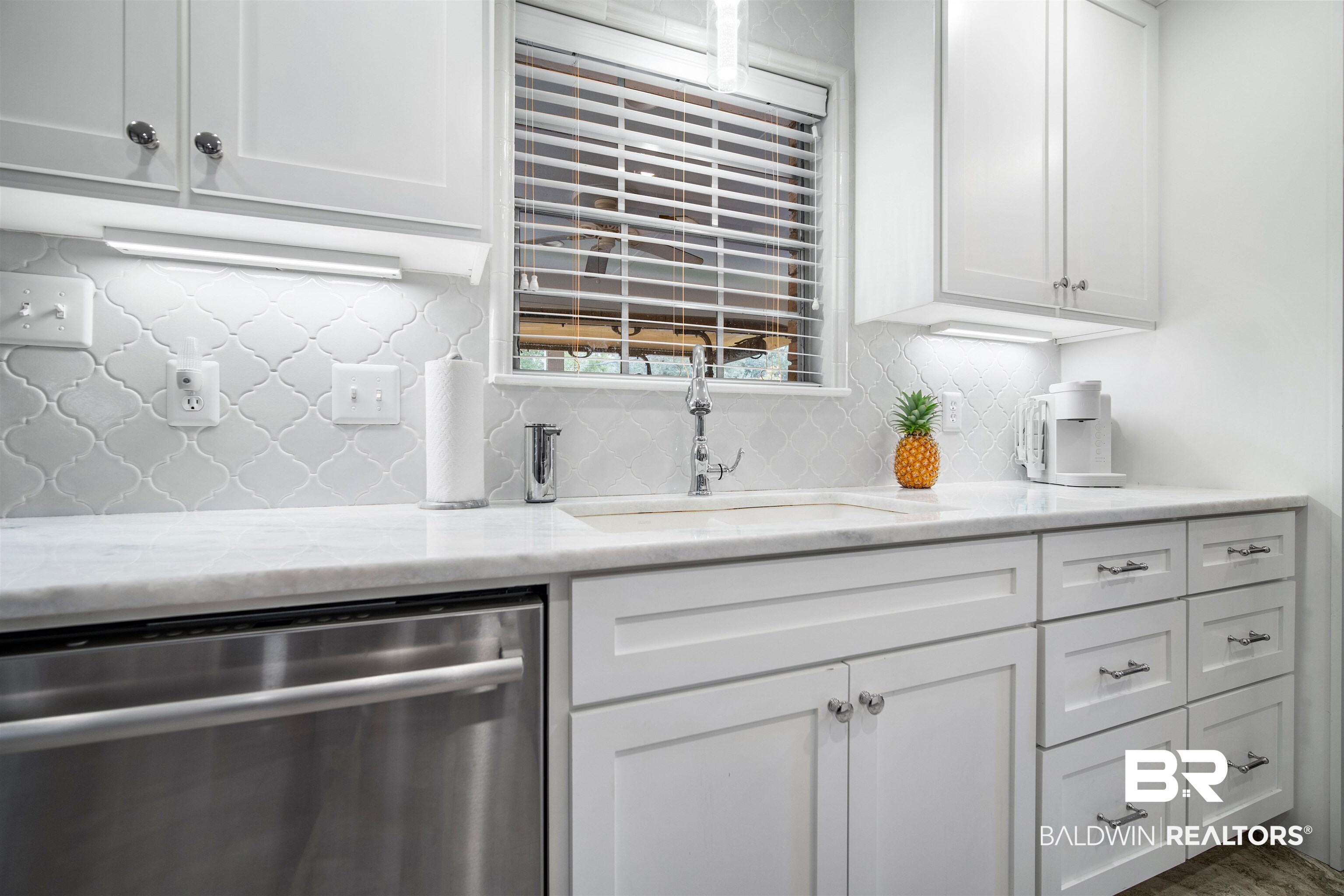 4228 Spring Valley Drive South Mobile, AL 36693 - Photo 8 of 31 Kitchen with white cabinets, sink, stainless steel dishwasher, decorative backsplash, and light stone countertops