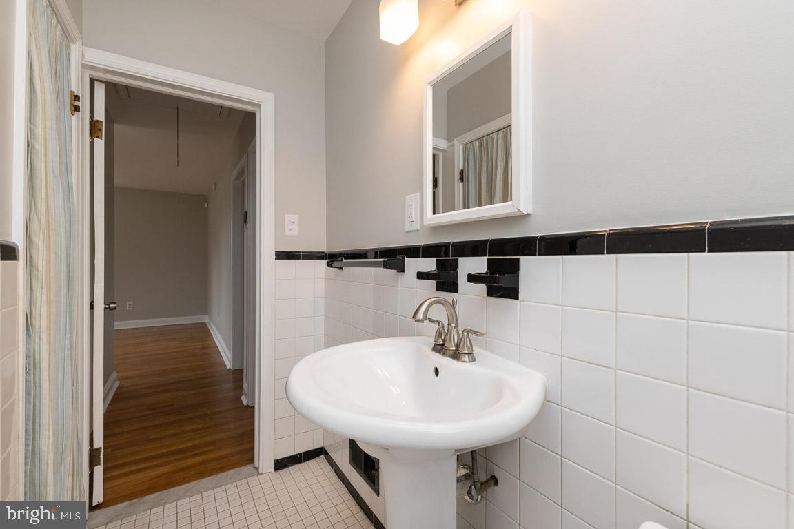 5921 Shady Spring Avenue Rosedale, MD 21237 - Photo 21 of 33 Hall Bath has a storage area on the left