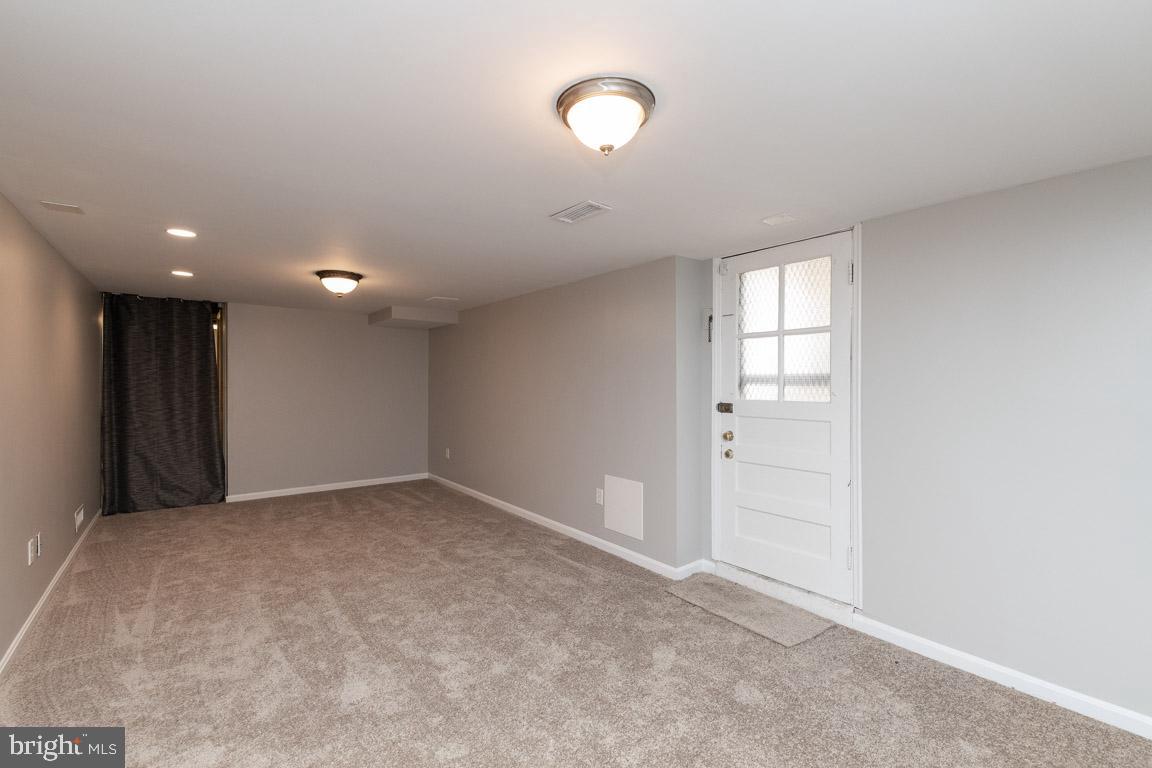 5921 Shady Spring Avenue Rosedale, MD 21237 - Photo 23 of 33 Finished Portion of Lower with side exit