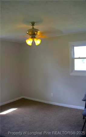 a bedroom with a bed and a lamp