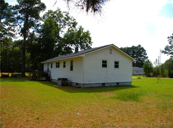 a house with trees in the background