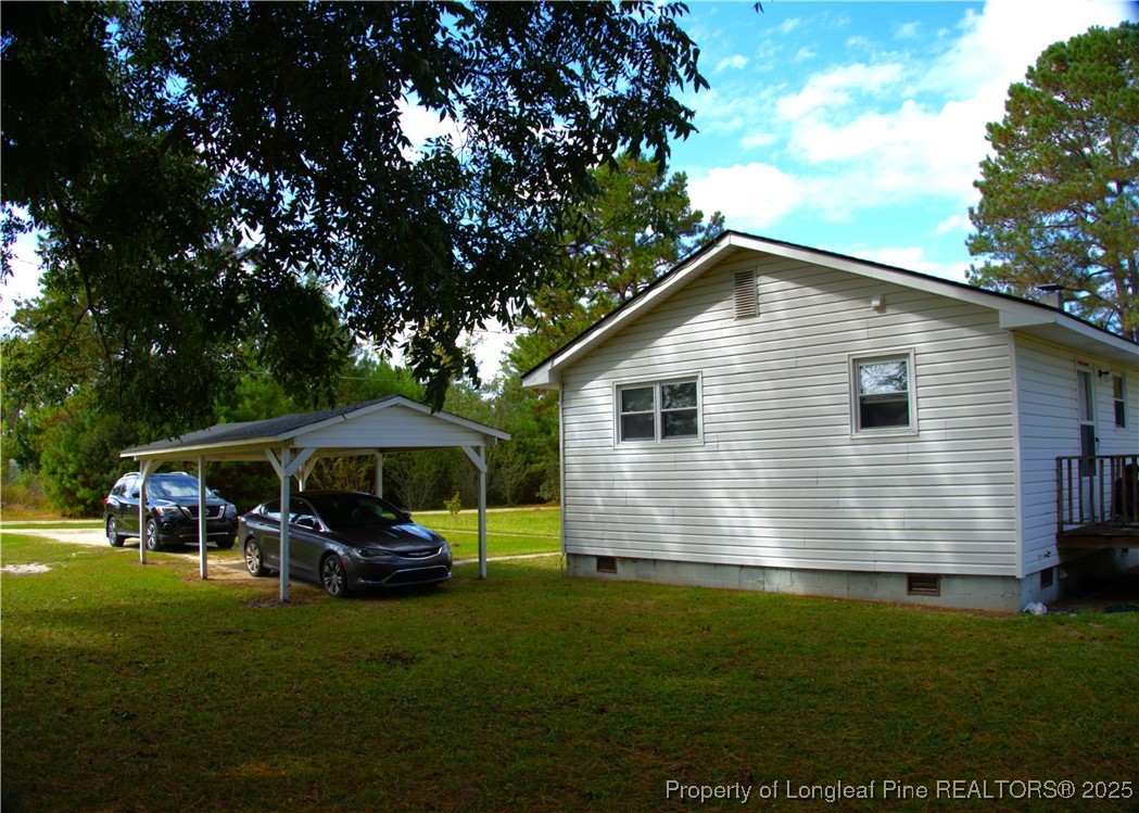 37 Jernigan Road Pembroke, NC 28372 - Photo 4 of 12 a front view of a house with garden