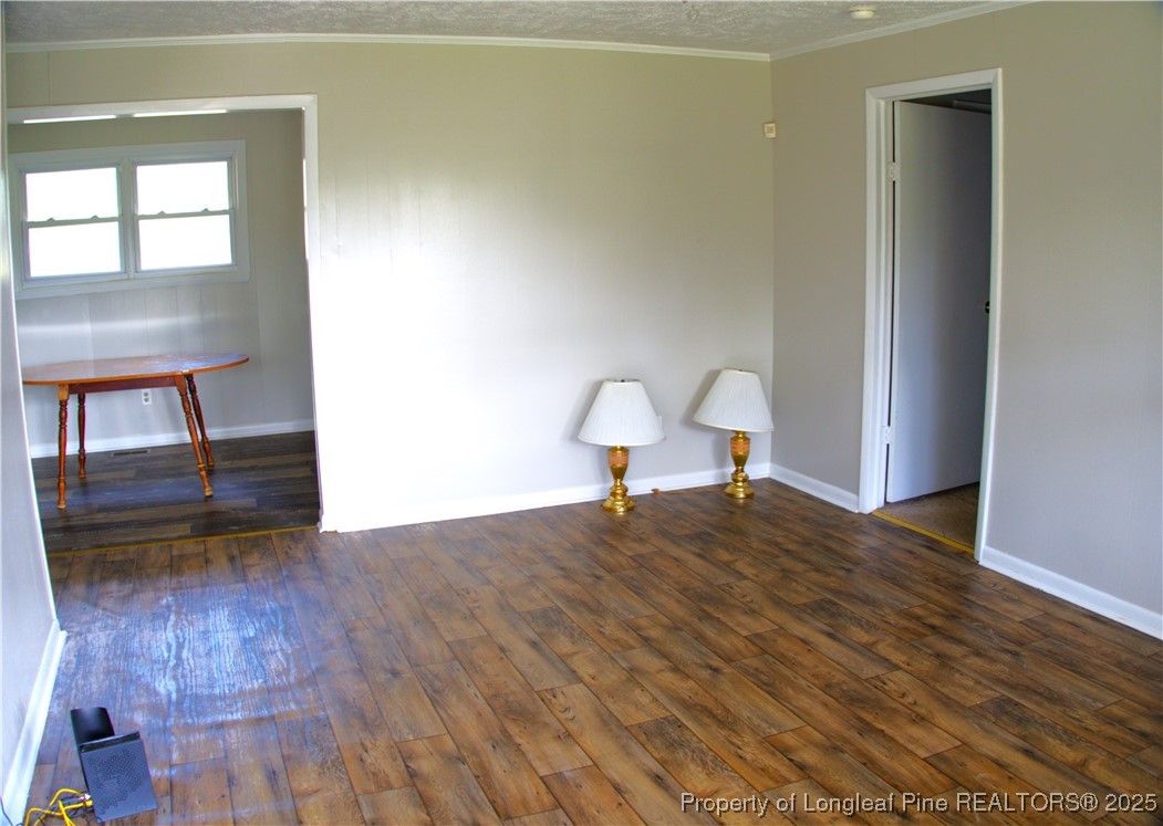 37 Jernigan Road Pembroke, NC 28372 - Photo 5 of 12 a view of empty room with wooden floor and fan