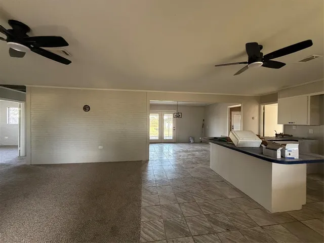 a view of a swimming pool with an outdoor seating