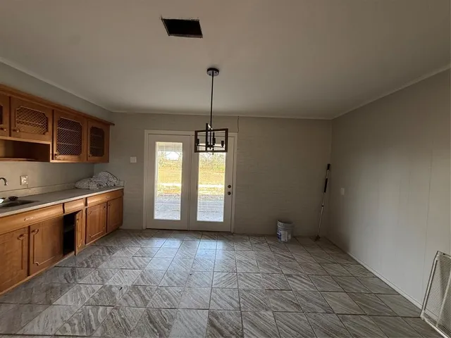 a kitchen with stainless steel appliances granite countertop a sink and a stove