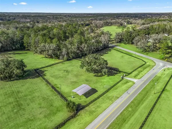 a view of a golf ground with a fountain