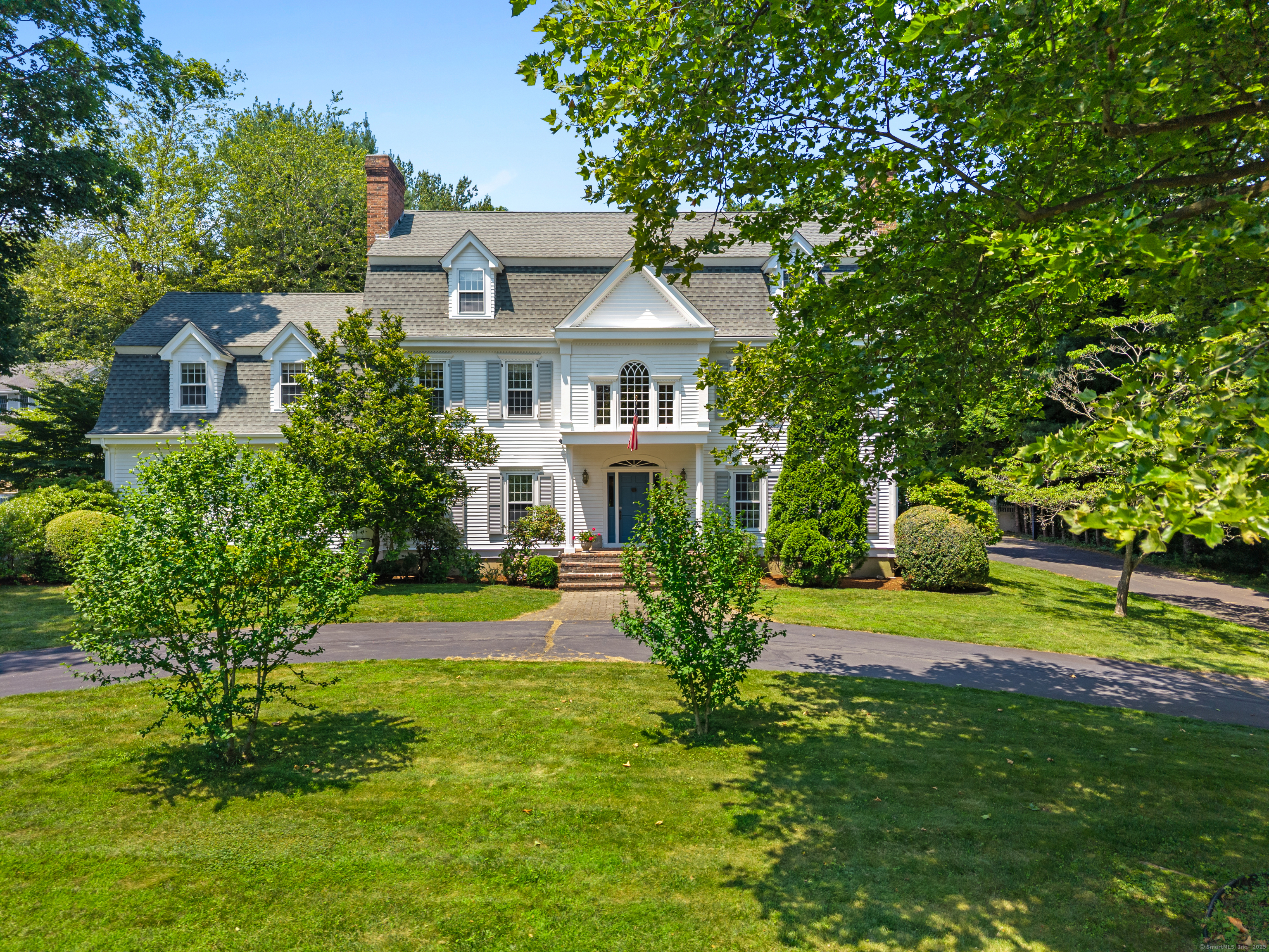 110 Randi Drive Madison, CT 06443 - Photo 1 of 1 a front view of house with yard and green space