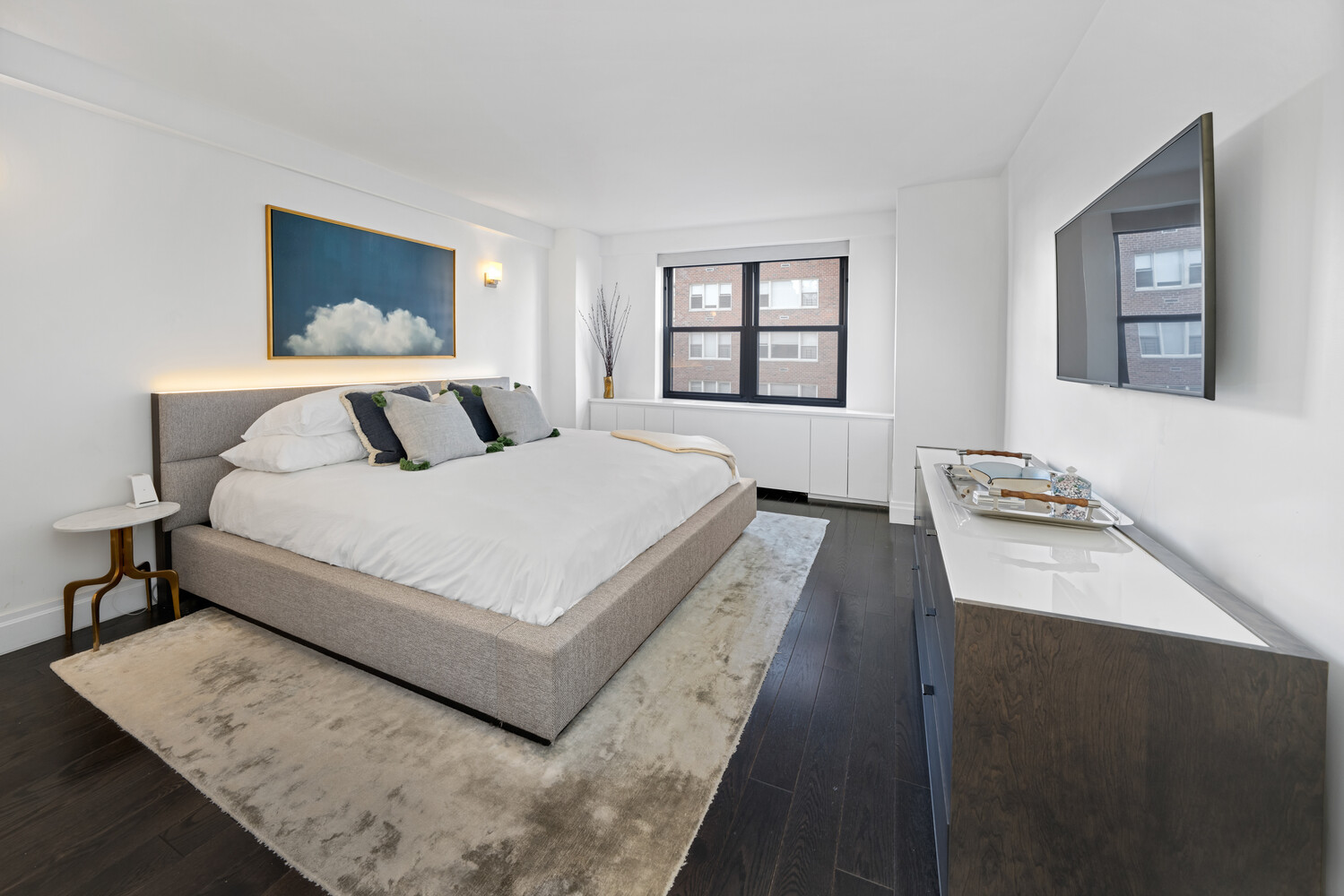 196 East 75th Street, Unit 9A Manhattan, NY 10021 - Photo 5 of 10 a bedroom with a bed and window
