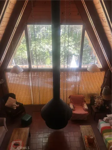 a view of a chair and table in the balcony