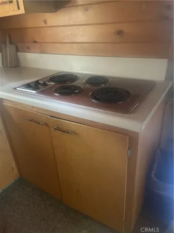 a room with a sink and cabinets