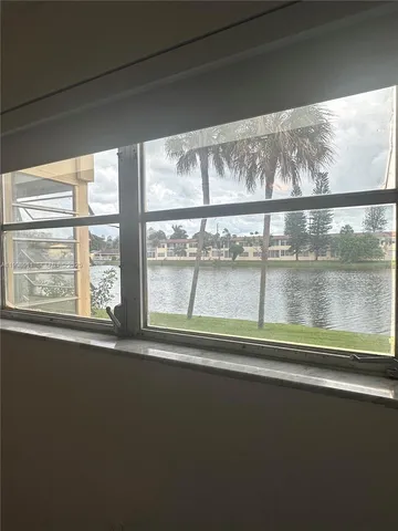 a view of a room that has a window and a view of outdoor space