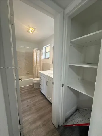 a bathroom with a double vanity sink and mirror