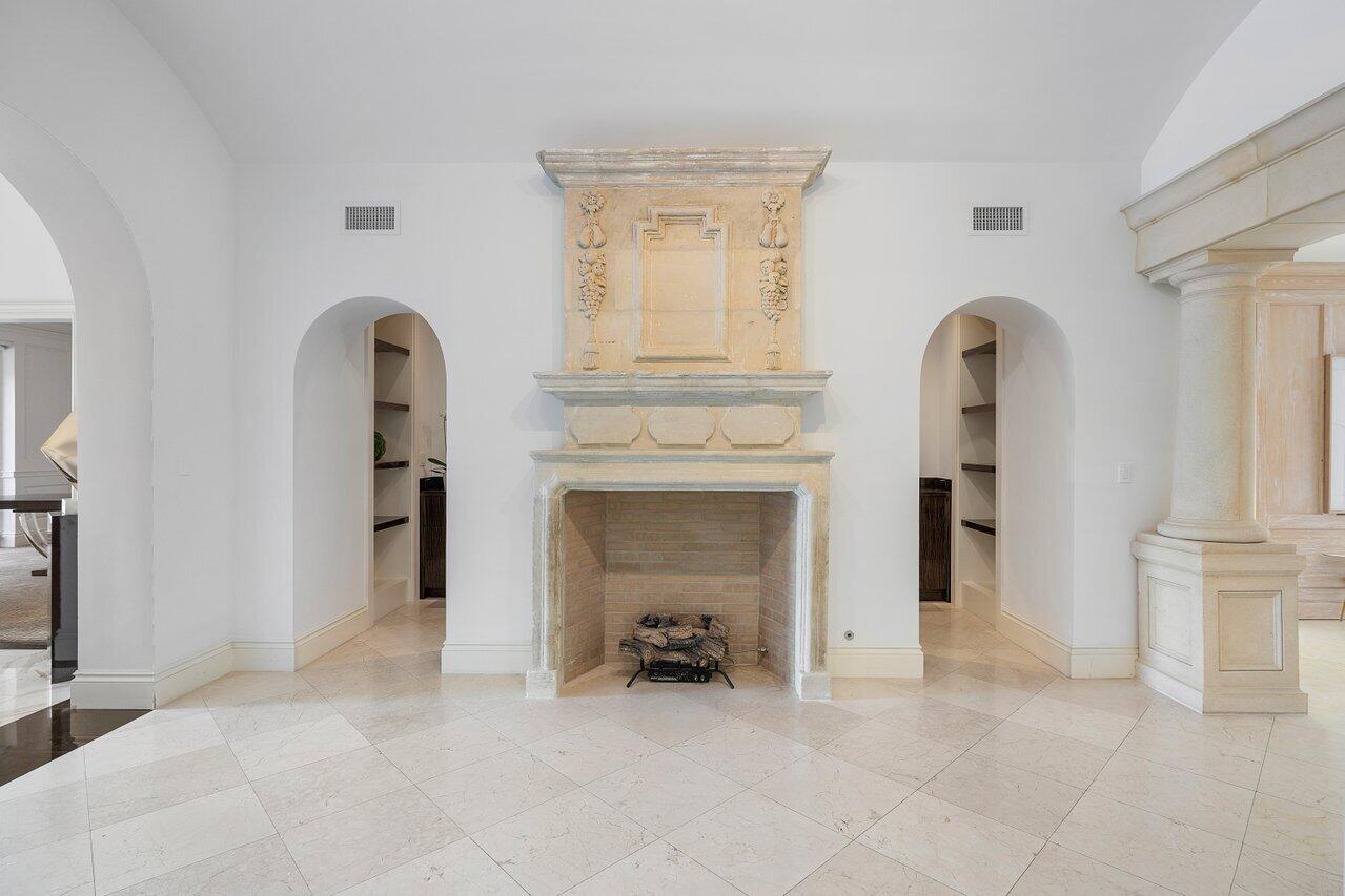 168 Kings Road Palm Beach, FL 33480 - Photo 11 of 49 a view of an empty room with fireplace and a window