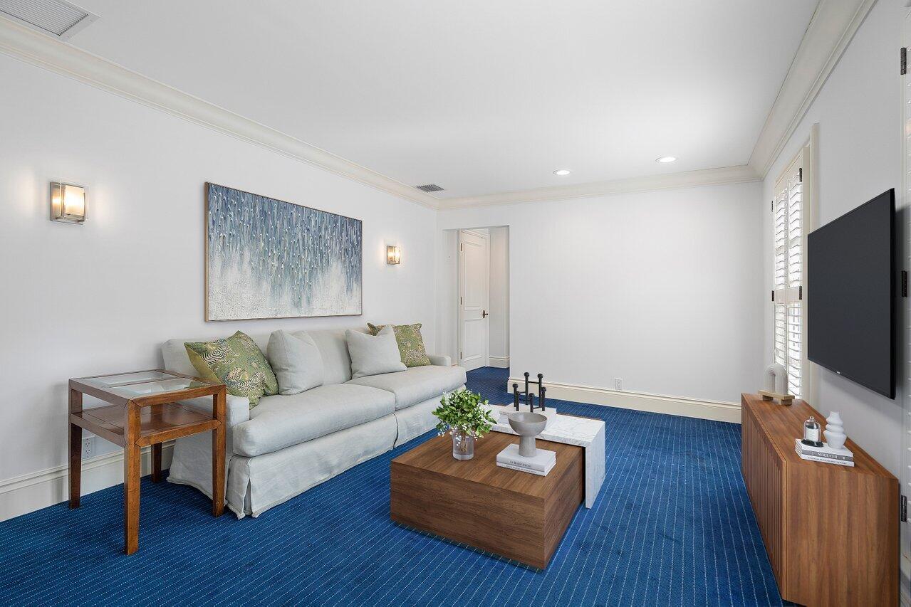 168 Kings Road Palm Beach, FL 33480 - Photo 37 of 49 a living room with furniture and a flat screen tv