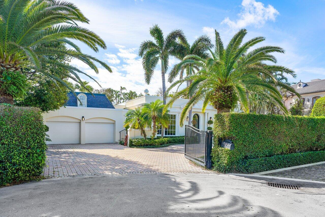 168 Kings Road Palm Beach, FL 33480 - Photo 47 of 49 a front view of a house with a garden