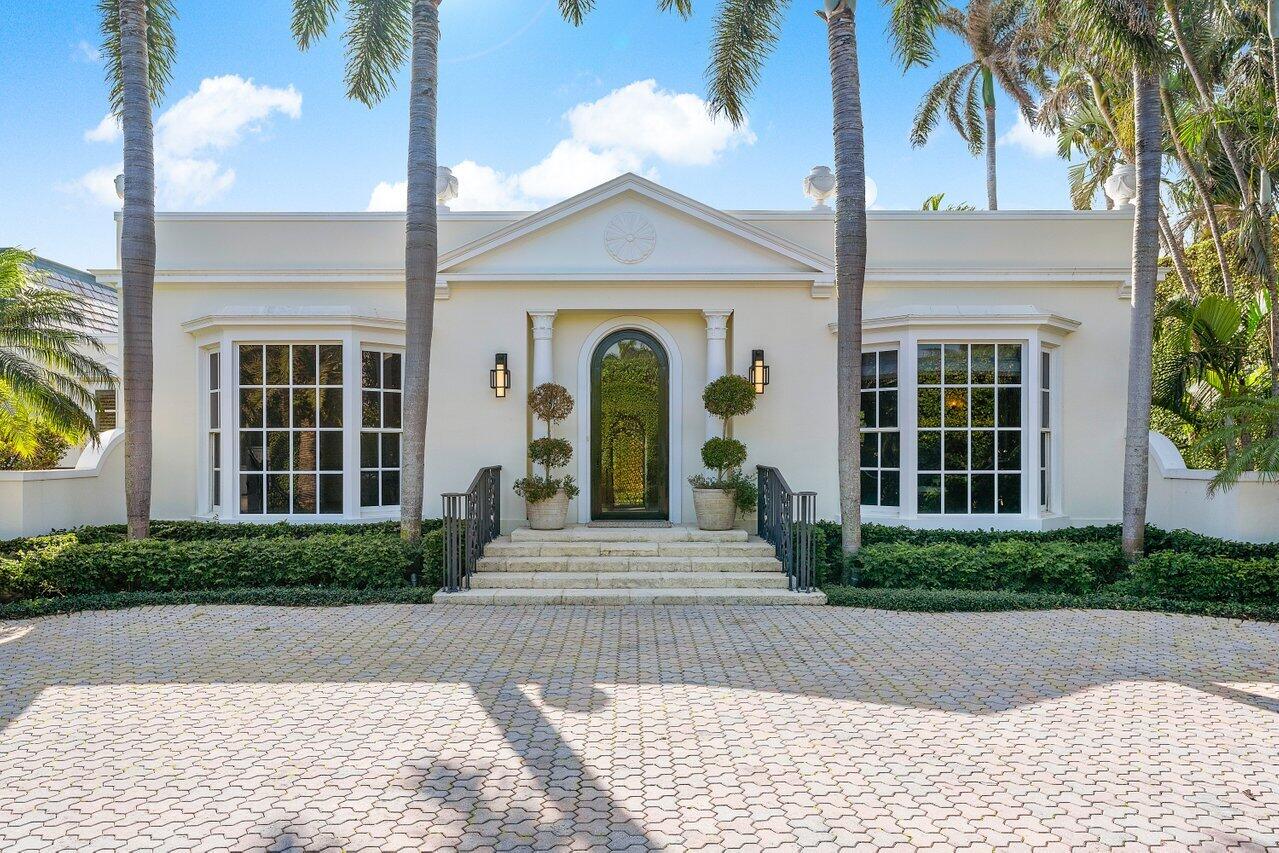 168 Kings Road Palm Beach, FL 33480 - Photo 5 of 49 a front view of a house with garden