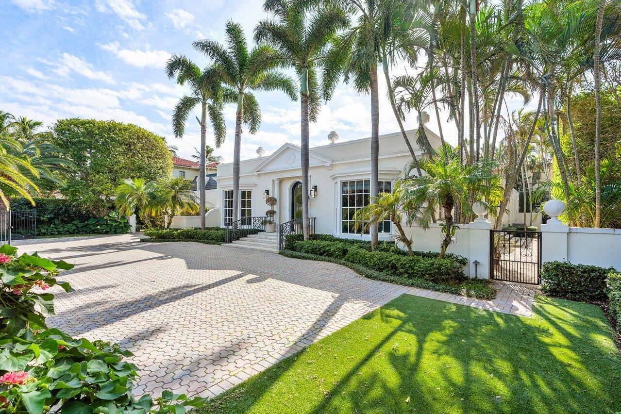 168 Kings Road Palm Beach, FL 33480 - Photo 6 of 49 a view of a garden with palm trees