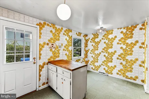 a view of an entryway with wooden floor
