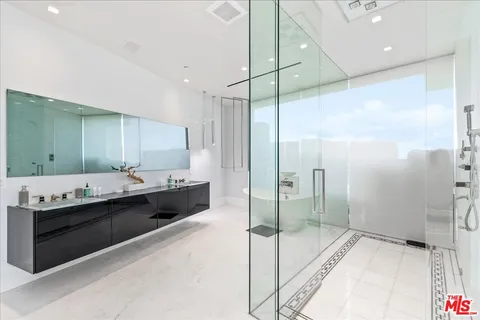 a bathroom with a bathtub shower sink and toilet