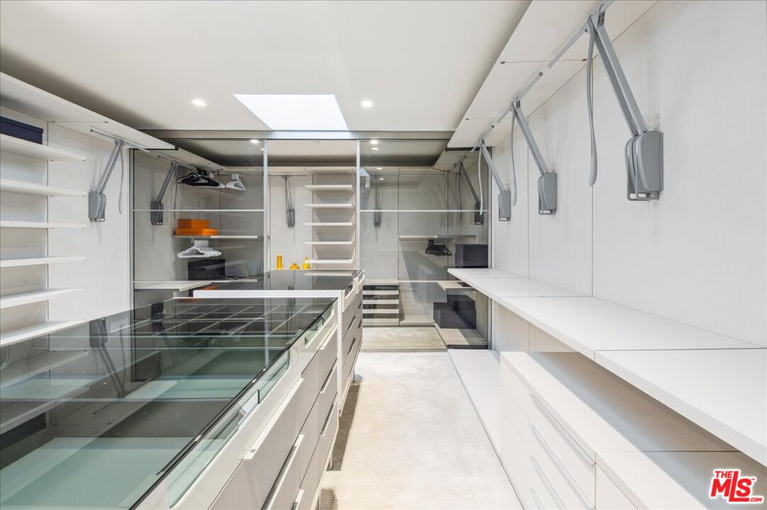 1620 Carla Ridge Beverly Hills, CA 90210 - Photo 26 of 42 a view of a kitchen with a sink and cabinets