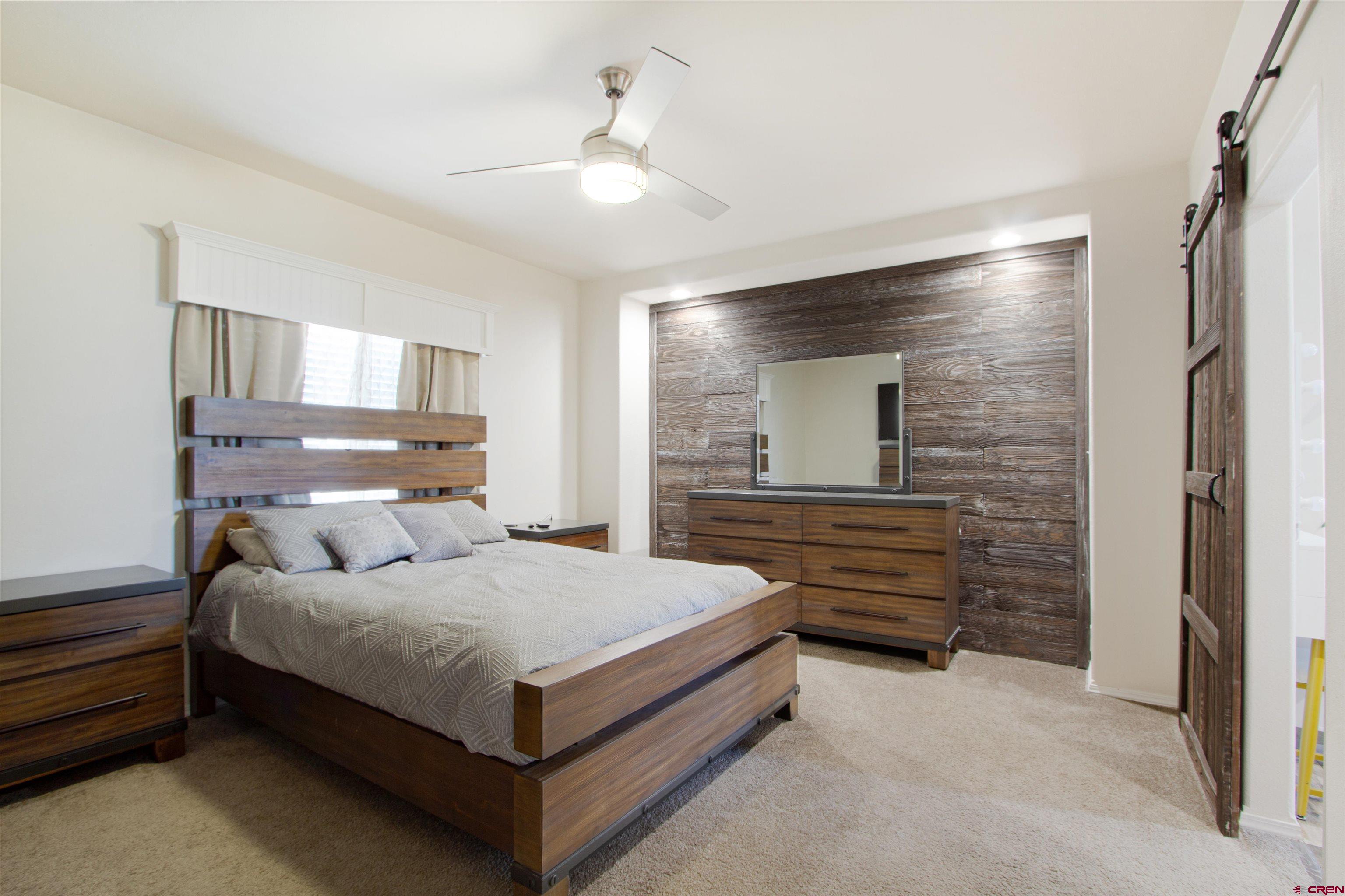 62069 Jade Road Montrose, CO 81401 - Photo 14 of 29 a bedroom with a bed and window