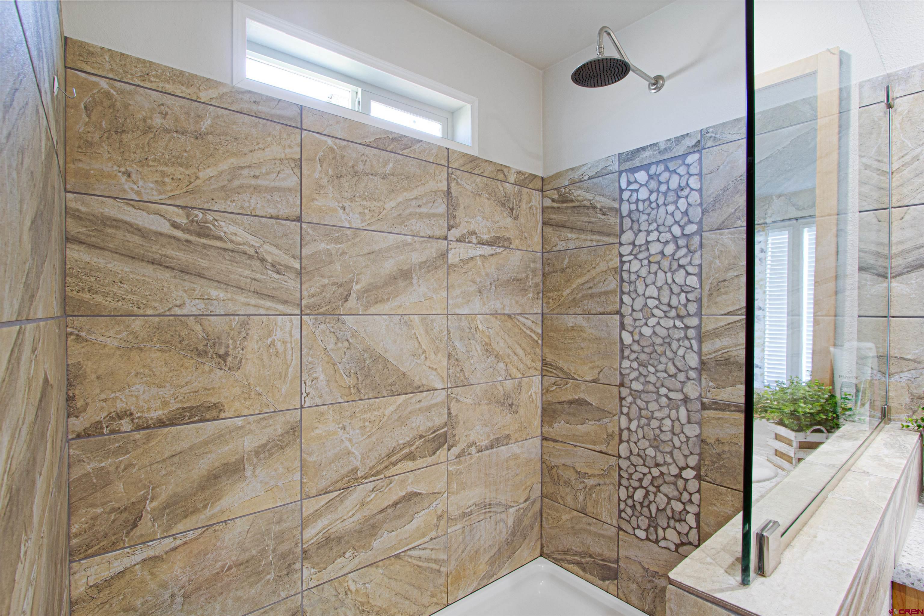 62069 Jade Road Montrose, CO 81401 - Photo 18 of 29 a bathroom with a shower