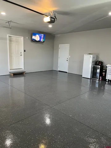 a view of a livingroom with an empty space and a window