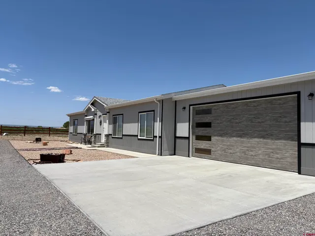 a view of yard with swimming pool and green space