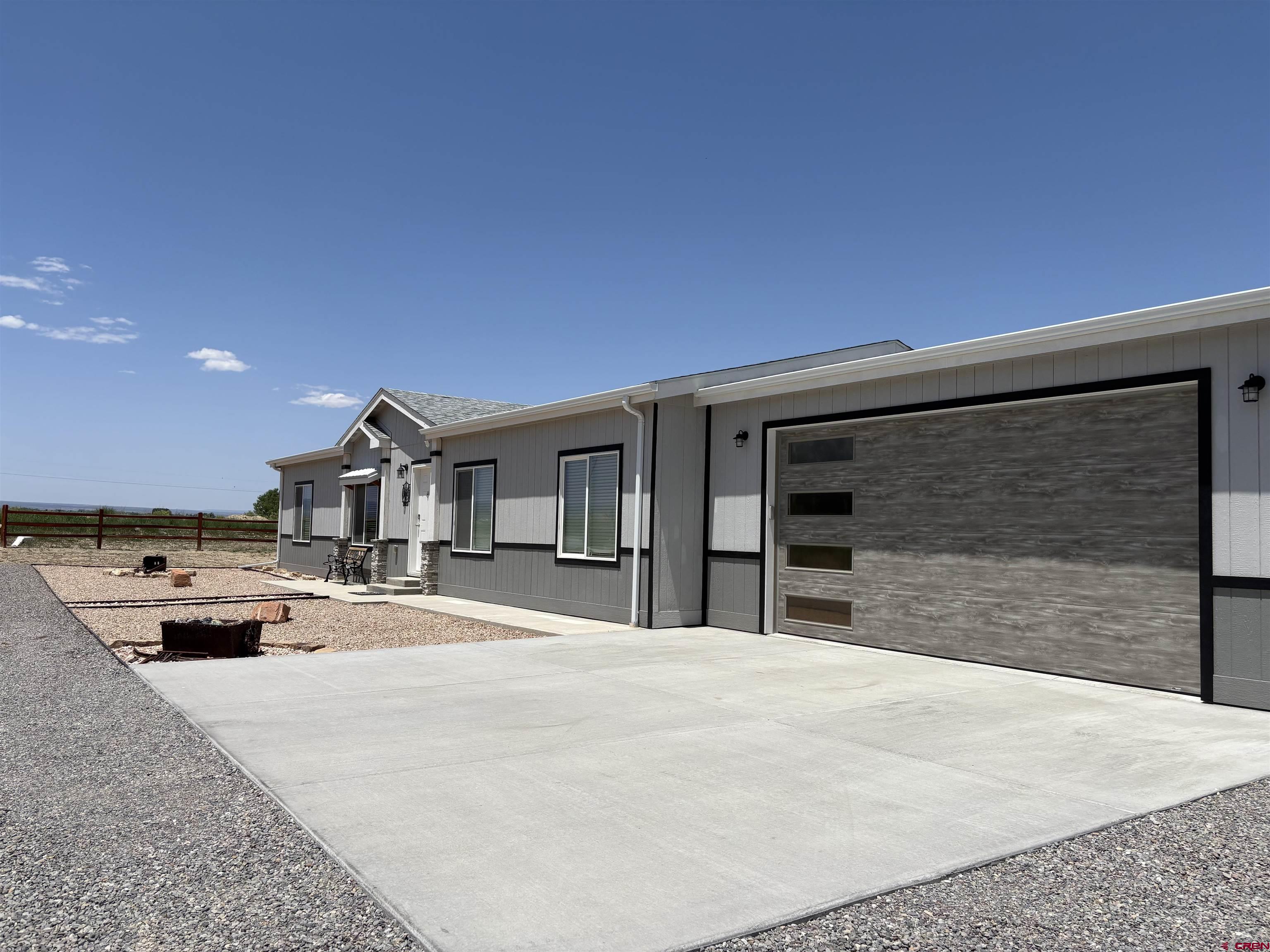 62069 Jade Road Montrose, CO 81401 - Photo 22 of 29 a house view with a outdoor space