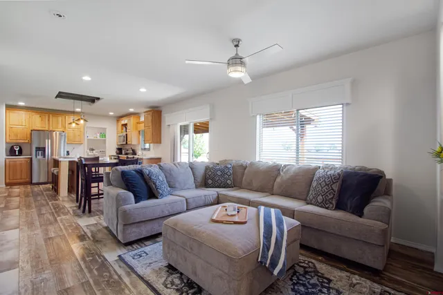 a living room with furniture and a large window