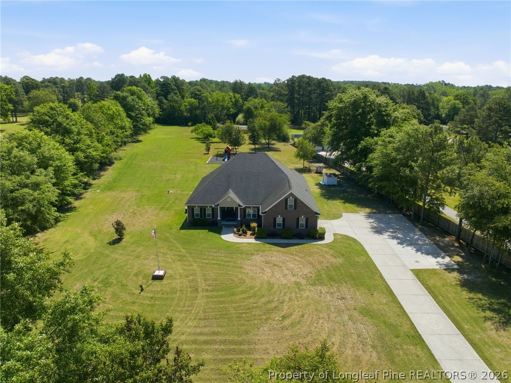 2589 June Johnson Road Raeford, NC 28376 - Photo 47 of 49 a view of a swimming pool with a yard