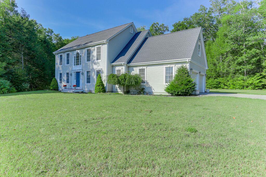 82 Cross Road Chaplin, CT 06235 - Photo 1 of 1 a view of a house next to a big yard and large trees
