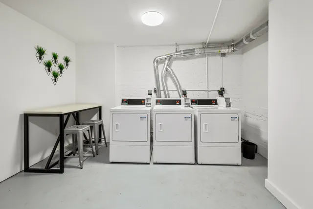 a view of a storage & utility room with washer and dryer