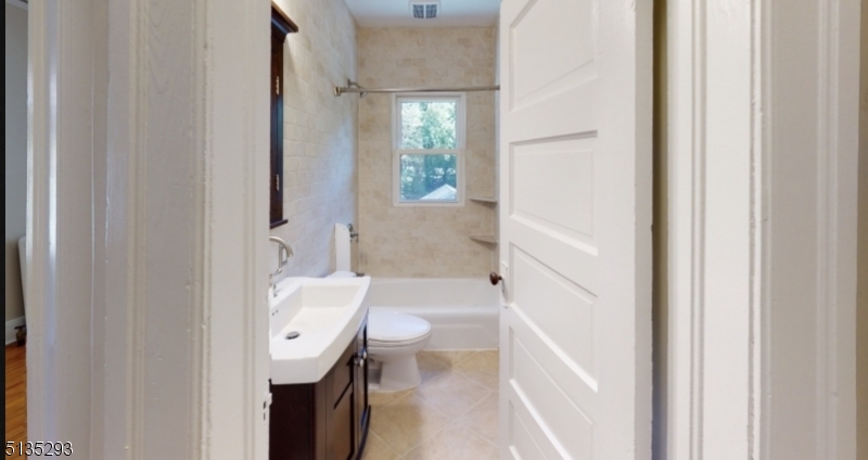 40-42 Dunnell Road Maplewood, NJ 07040 - Photo 7 of 11 a bathroom with a sink a toilet and shower