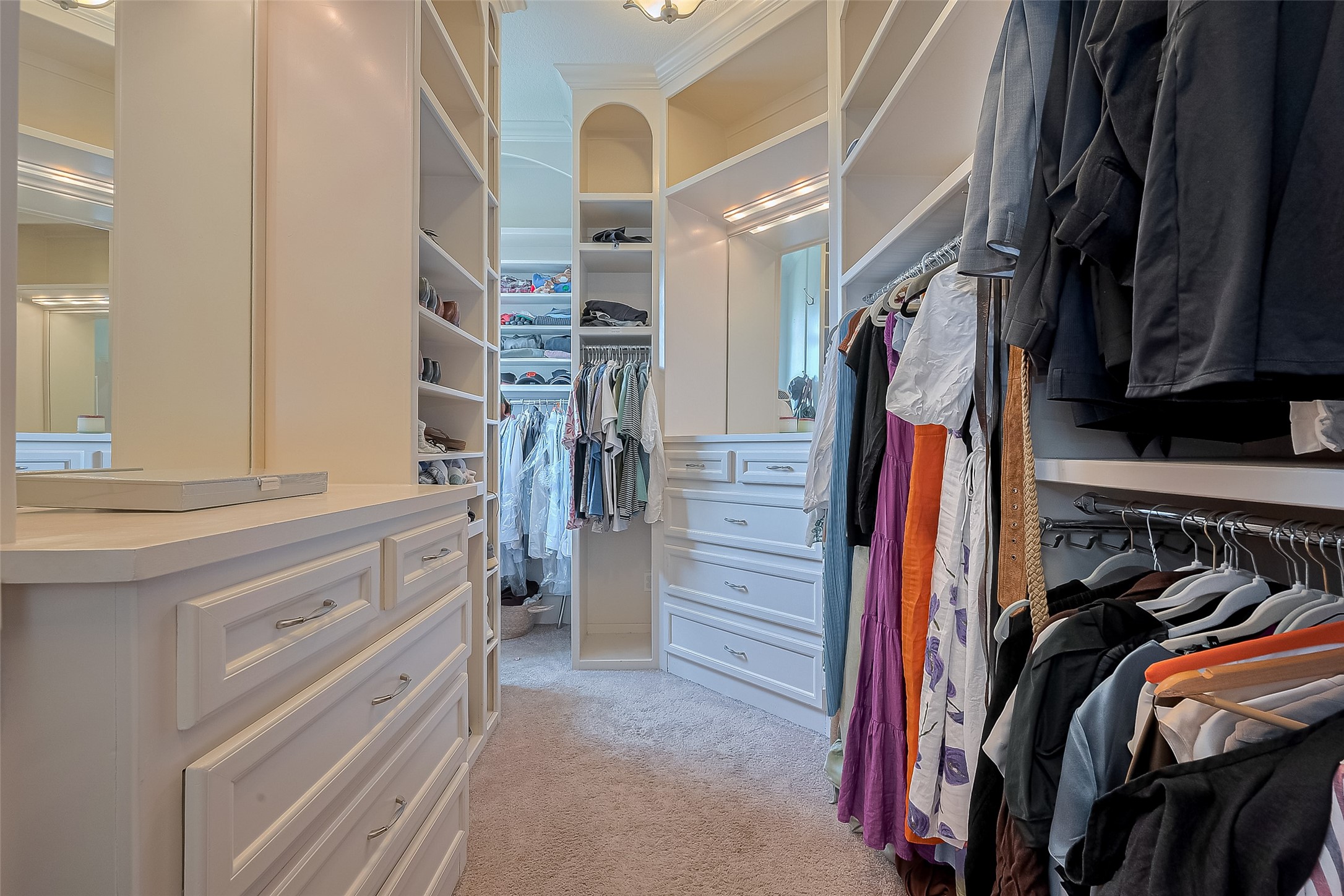 6419 Rodrigo Street Houston, TX 77007 - Photo 35 of 35 This primary walk-in closet has ample drawers and hanging space for all your clothes and possessions!