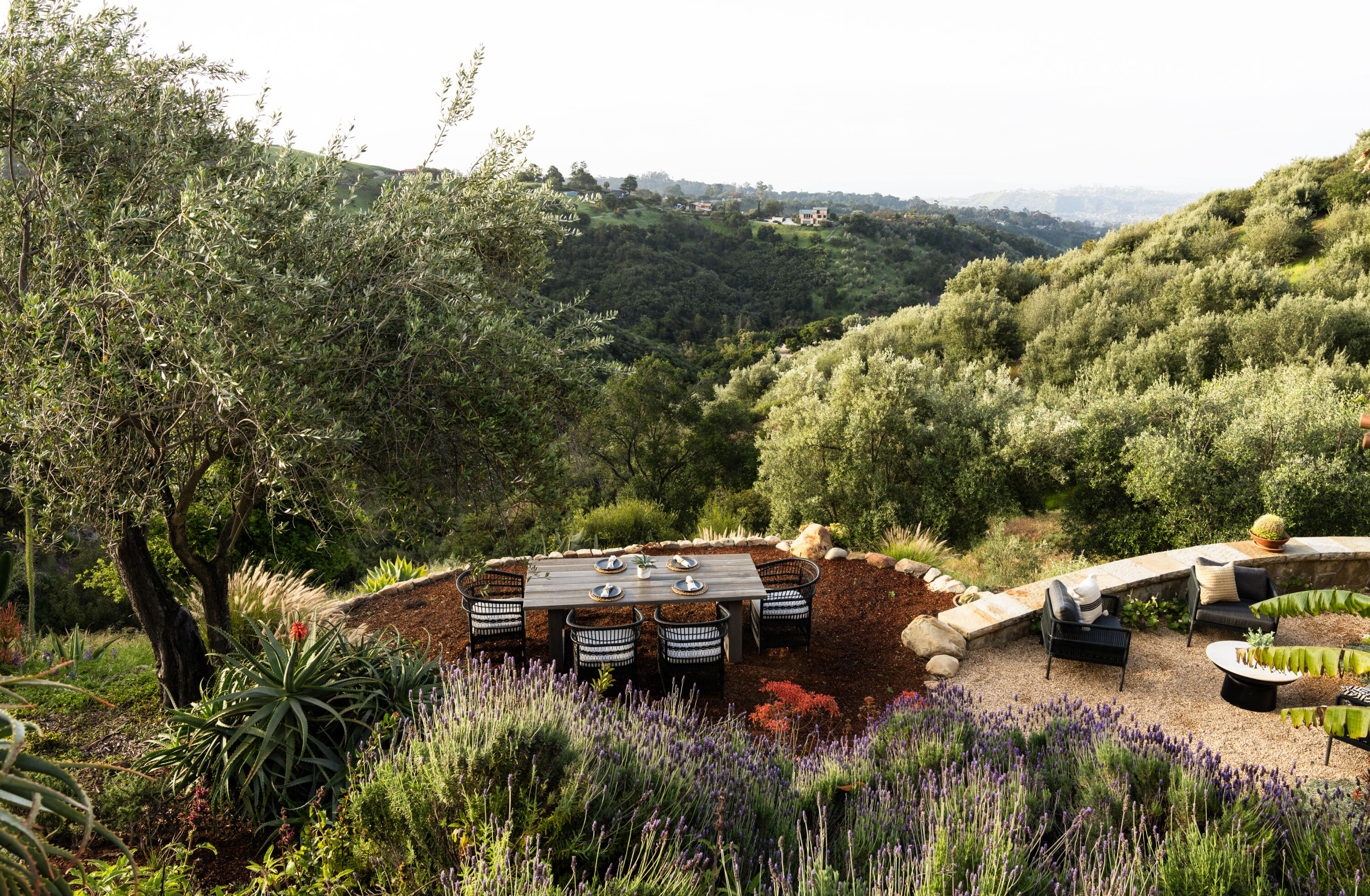 1480 Mission Canyon Road Santa Barbara, CA 93105 - Photo 26 of 38 a view of a patio with lawn chairs under an umbrella