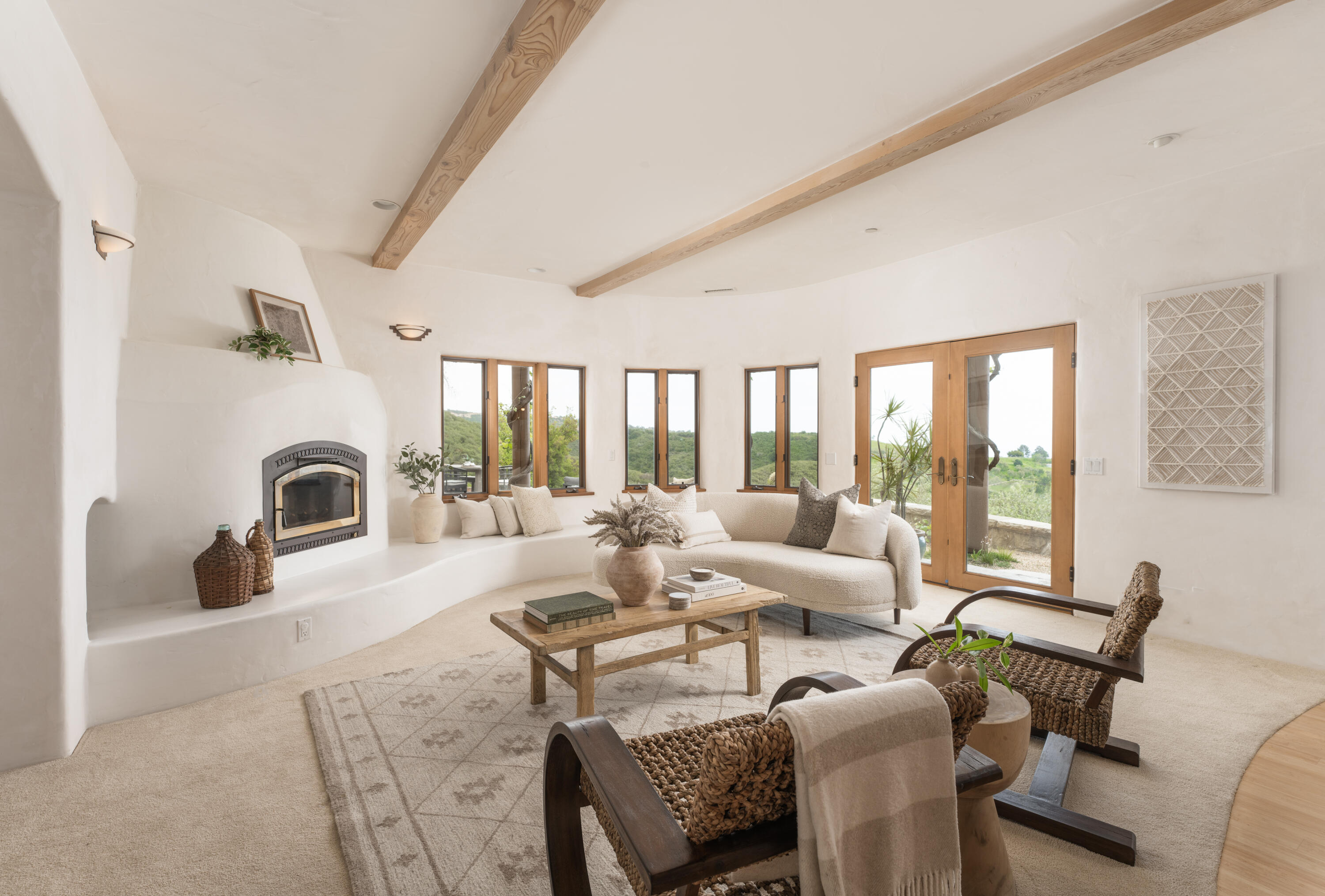 1480 Mission Canyon Road Santa Barbara, CA 93105 - Photo 9 of 38 a living room with furniture a large window and a fireplace