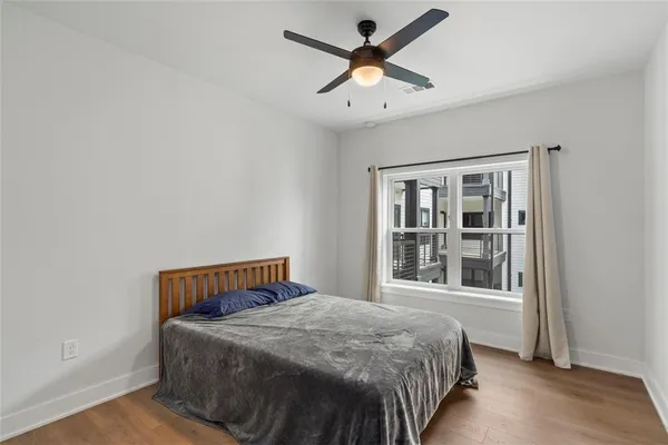 a bedroom with a bed and window