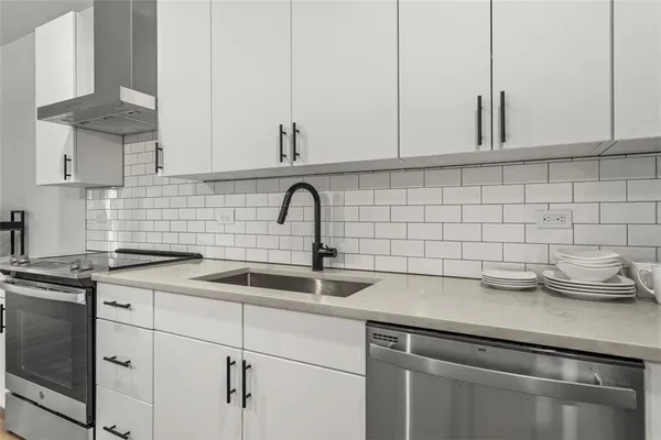 a kitchen with a sink and cabinets