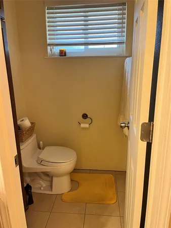 a bedroom with a bed and cabinets