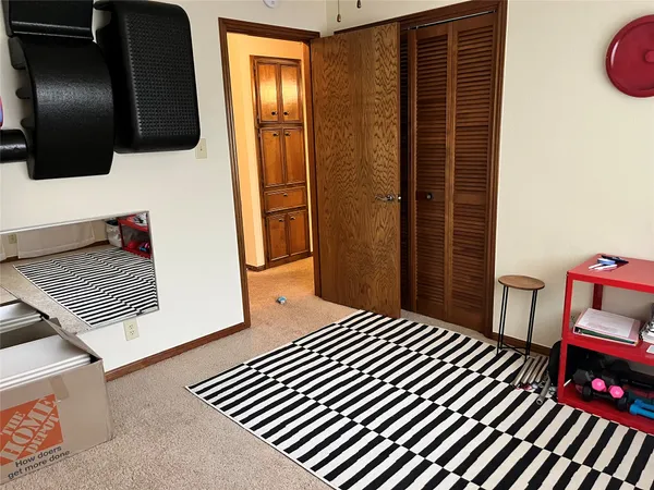 a view of a room with rack on the wall and a window