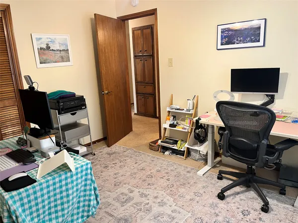 a bedroom with furniture and a window